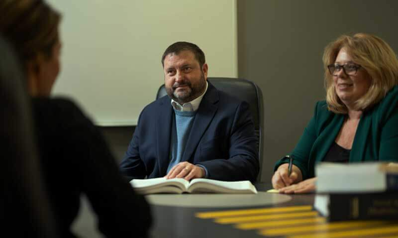 Keefe Law Attorneys meeting a client