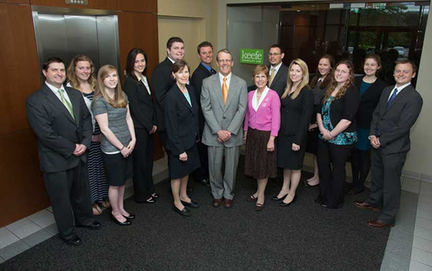 Keefe Law staff standing in front of office